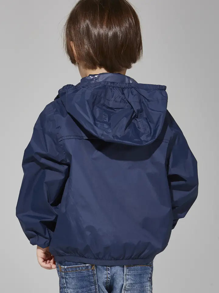 Child wearing the O8 navy packable rain jacket, back view