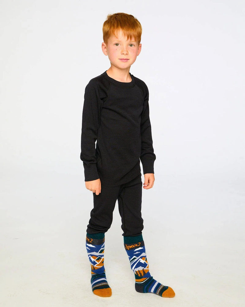 Child wearing the Black merino-blend base layer set, front view