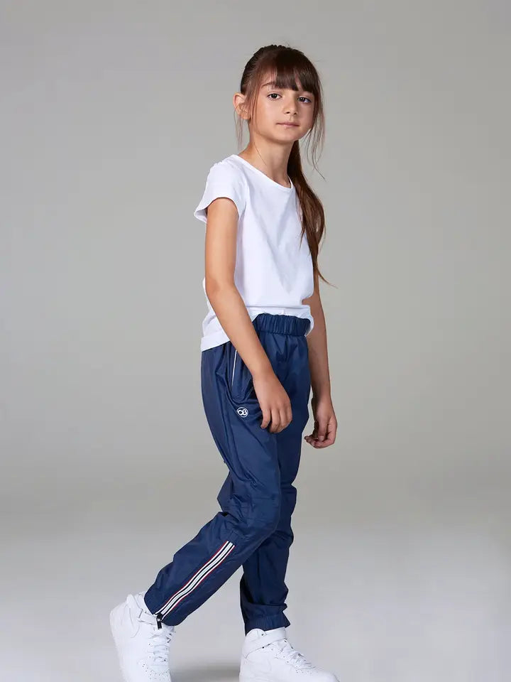 Child wearing the O8 navy rainproof pants, front view
